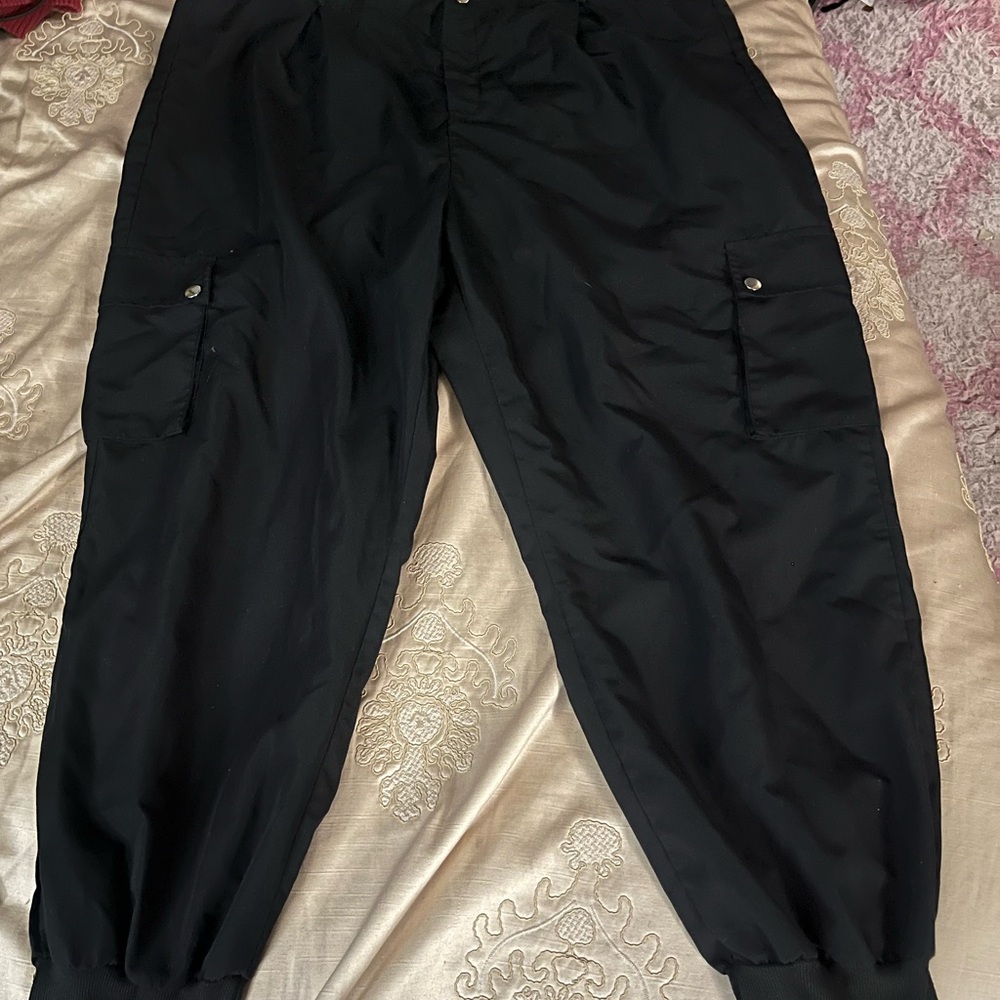 Plus size, women’s Black Cargo Pants. 100% Polyester.